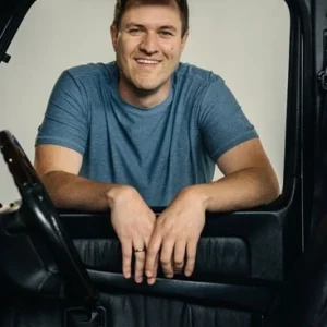 Doug De Moro is staring out the window of his Jeep.