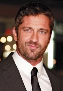 Gerard Butler is laughing. 