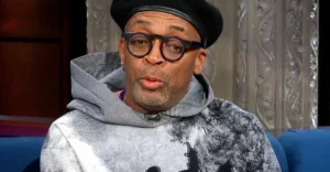 Spike Lee is sitting on the TV show.