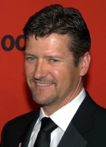Todd Palin is laughing at something.