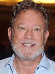 Christopher Rich is laughing.