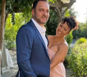 Adam Housley is holding his wife.