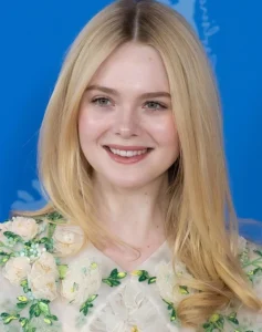 Elle Fanning is laughing.