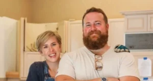 Ben and Erin Napier are both standing.