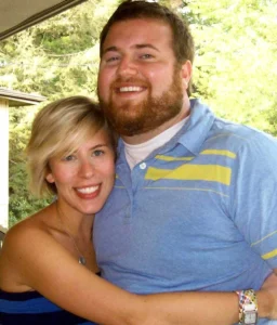 Ben and Erin Napier both hug.