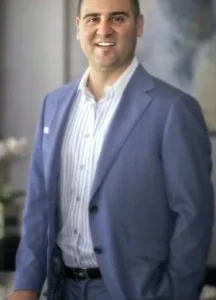 Misha Azrati is laughing.