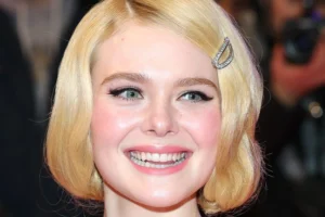 Elle Fanning is laughing.