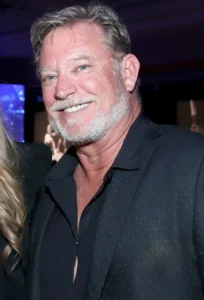 Christopher Rich is laughing.
