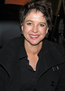 Christy McNichol is wearing a black dress.
