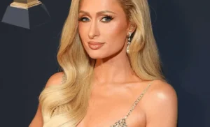 Paris Hilton is smiling.