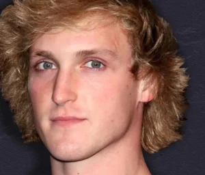 Logan Paul is smiling.