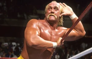 Hulk Hogan is holding his head with his hand.
