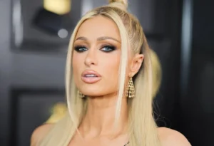 Paris Hilton looks on in surprise.