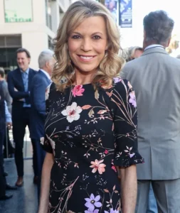 Vanna White is standing outside.