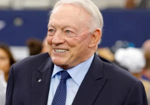 Jerry Jones is laughing at something.