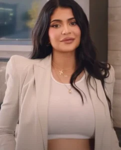 Kylie Jenner is smiling.