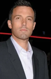 Ben Affleck is smiling.