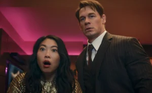 John Cena and the girl are watching in amazement as they star in the movie.