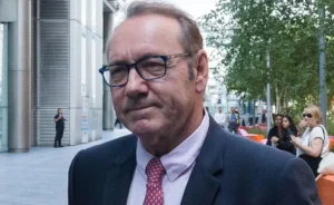 Kevin Spacey is walking outside.