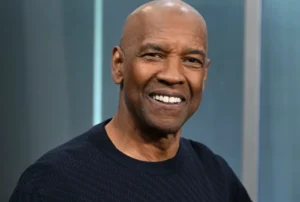 Denzel Washington is laughing.