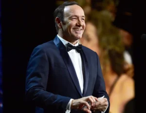 Kevin Spacey is laughing.