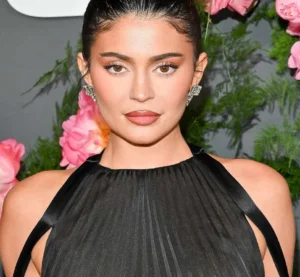 Kylie Jenner looks on in surprise.