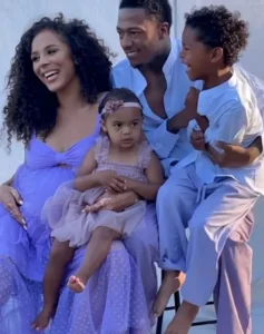 Nick Cannon is laughing out loud with his wife and children.