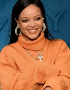 Rihanna is laughing.