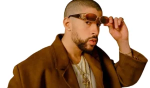 Bad Bunny is taking off his glasses.