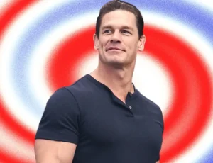 John Cena is smiling.