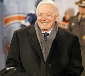 Jerry Jones is wearing a sweater.