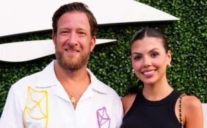Dave Portnoy is laughing while standing next to the girl.