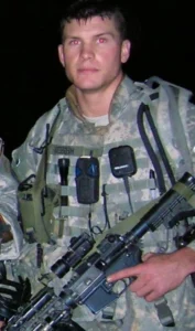 Pat Hegseth is wearing a military uniform.