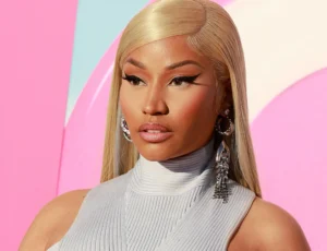 Nicki Minaj looks on sadly.