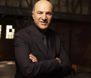 Kevin O'Leary stands with his hands tied.