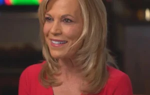Vanna White sits in the media.
