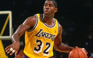 Magic Johnson is playing basketball.
