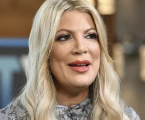 Tori Spelling smiles as she speaks, ready to go.
