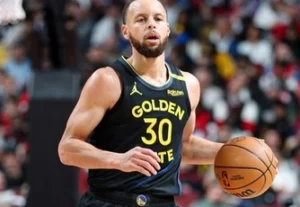 Stephen Curry is running with the ball.