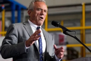 Robert F. Kennedy Jr. is speaking into the microphone.