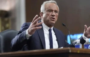 Robert F. Kennedy Jr. speaks while sitting in the House.