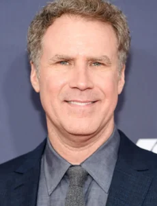 Will Ferrell is laughing while wearing a black coat.