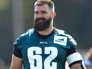 Jason Kelce is laughing in uniform.