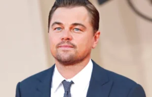 Leonardo DiCaprio is smiling.