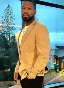 50 cents is standing with his hand in his pocket.
