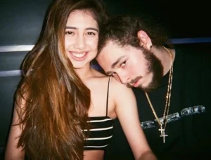Melvin rests his head on the girl's shoulder.