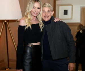 Shannen Doherty puts her hand on the boy's shoulder and they are both laughing.