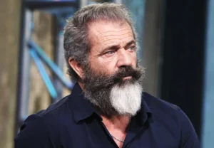 Mel Gibson looks on in surprise.
