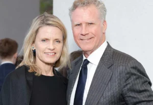 Will Ferrell is laughing while standing next to his wife.