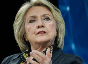 Hillary Clinton looks up while speaking.